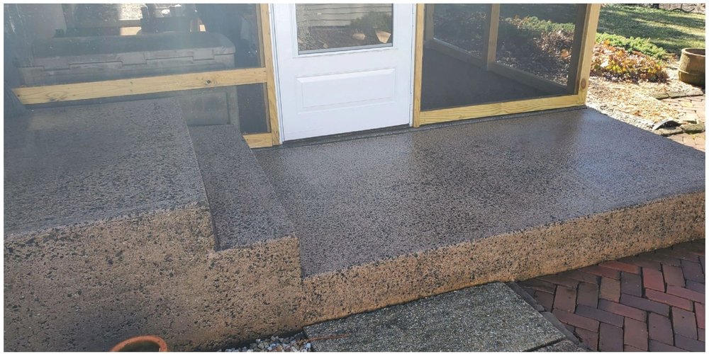 Same concrete steps after pressure washing, clean and bright